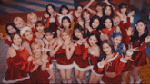 a group of women are posing for a picture in santa costumes