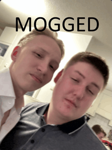 two men are standing next to each other and the word mogged is on the bottom