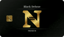 a black deluxe pass with a gold n on it