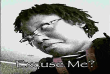 a black and white photo of a man wearing glasses and the words `` excuse me '' .