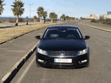 a black car with a license plate that says gp-7819