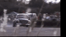 a blurred image of a car driving down a road