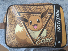 a pokemon eevee cosmetic bag with a pattern on it