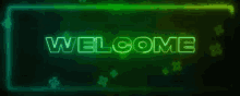 a neon sign that says `` welcome '' on a black background