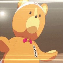 a teddy bear wearing a white headband with the word high on it