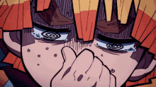 a close up of a cartoon character 's face with tears running down his face .