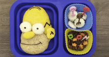 a blue tray with a homer simpson face on it