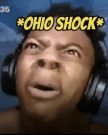a man wearing headphones has a surprised look on his face and the words ohio shock above his head