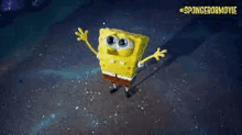 spongebob is standing in the water with his arms outstretched in the air .