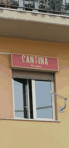 a window with a sign that says cantina on it