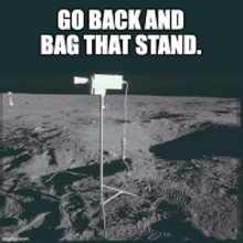 a picture of a camera on the moon with the caption go back and bag that stand