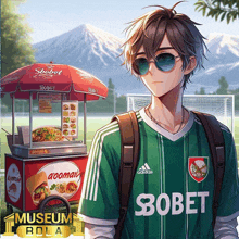 a boy wearing a green adidas shirt stands in front of a food stand