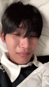 a close up of a person laying on a bed