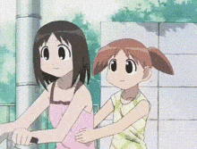 two cartoon girls are standing next to each other on a bike