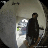 a ring camera shows a man standing in a doorway on 04/07/2026