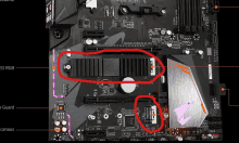 a close up of a motherboard with a red circle around a cpu cooler