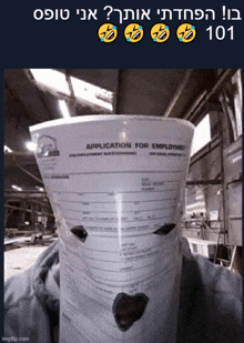 a large application for employment sitting on top of someone 's head