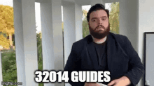 a man with a beard is standing on a porch holding a piece of paper and says `` 32014 guides '' .