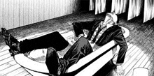 a man in a suit is laying in a bathtub with his legs crossed .