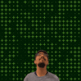 a man stands in front of a glowing number 9