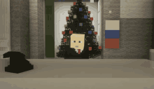 a pixelated christmas tree with a man 's face in front of it