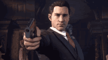 a man in a suit and tie pointing a gun at the camera