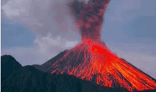 a volcano is erupting with a lot of lava coming out of it .