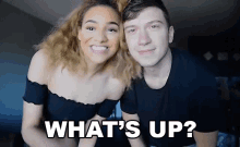 a man and a woman are posing for a picture with the words " what 's up " on the bottom