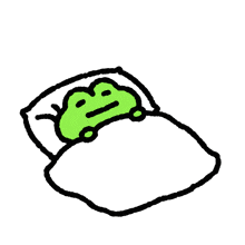 a green frog is laying in a bed with a pillow on top of it .