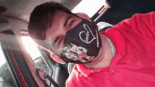 a man in a red shirt is wearing a mask that says ' sorin presidente ' on it