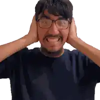 a man with glasses and a beard is covering his ears