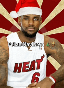 a basketball player wearing a santa hat and a heat shirt