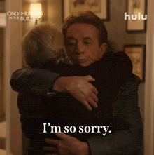a man hugging a woman with the words i 'm so sorry on the bottom