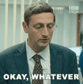a man in a suit and tie is saying " okay whatever "