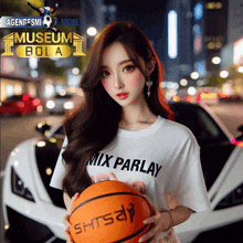 a woman wearing a white shirt that says mix parlay holds a basketball in front of a white car