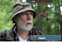 a man with a beard wearing a hat that says hunter