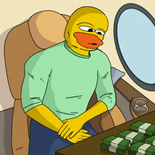 a cartoon of a man with a duck head sitting at a table with money