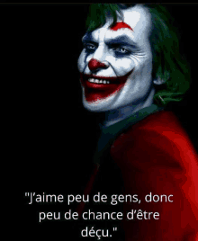 a painting of a clown with a quote in french on a black background .