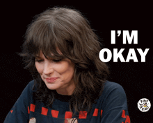 a woman says i 'm okay in a black background