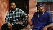 ice cube and snoop dogg are sitting on a porch talking