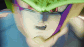 a close up of a person 's face with a purple and green stripe on it