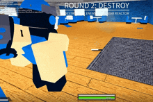 a screenshot of a video game with round 2 destroy written on the bottom