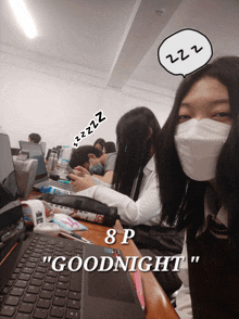 a girl wearing a mask sits at a desk with a laptop and a speech bubble that says " goodnight "