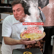 a man wearing headphones is holding a pizza in front of a sign that says rarepizzas.com on it