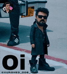 a man with a beard is standing on a sidewalk with the word oi on the side