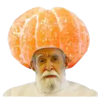 a man with a beard is wearing a hat made of an orange