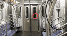 a subway car with a red circle around the door