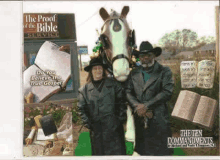 two men standing next to a horse with a sign that says the proof of the bible on it