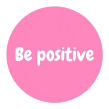 a pink circle with the words be positive in white letters