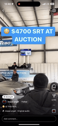 a phone screen shows a car being sold for $ 4700 srt at an auction